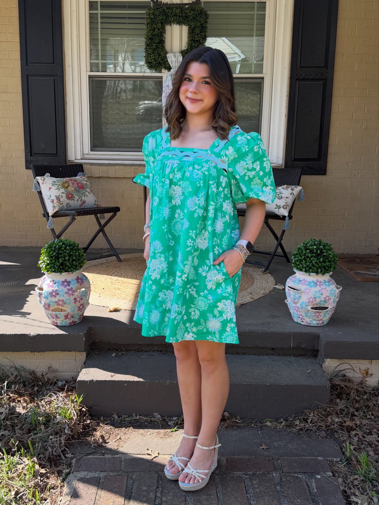 Green floral strut and bolt dress