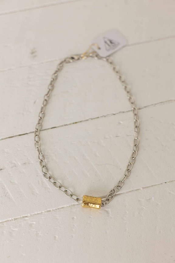 Weaving Color beaded tube necklace with silver chain and gold tube centerpiece on white background