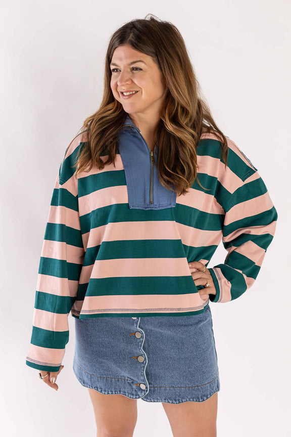 Woman wearing striped pullover and denim mini skirt with buttons by Weaving Color