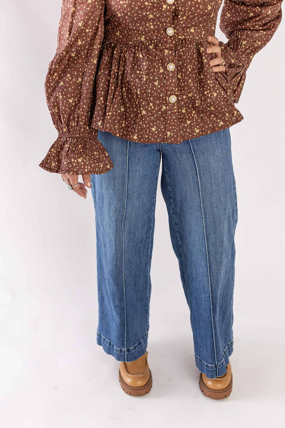 Weaving Color blue trouser wide leg pants styled with brown patterned blouse and tan shoes