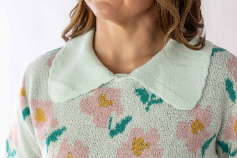 Weaving Color floral detail sweater with pastel pink and green flowers and a soft rounded collar