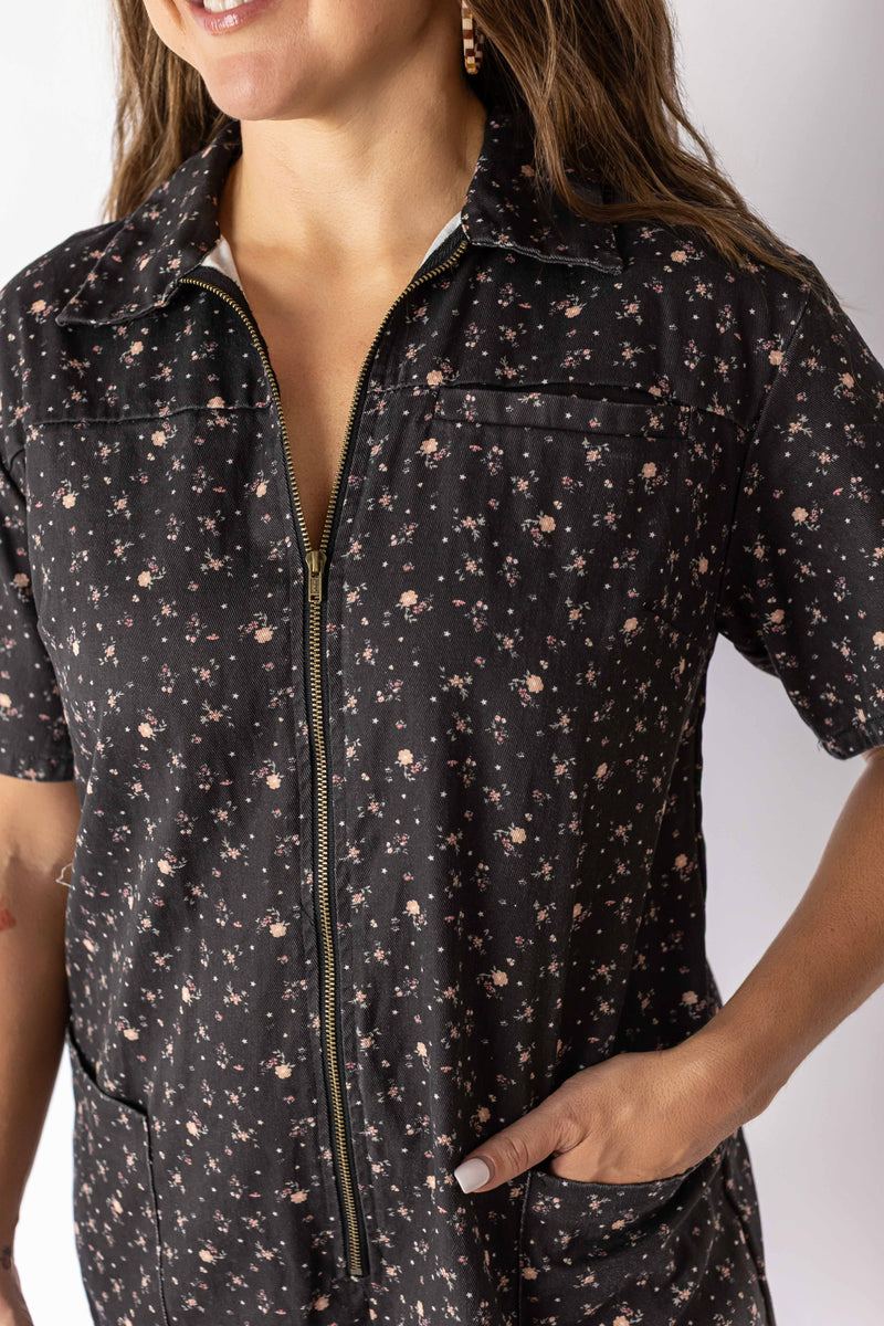Weaving Color floral zip romper in black with small pink flowers and front zipper detail