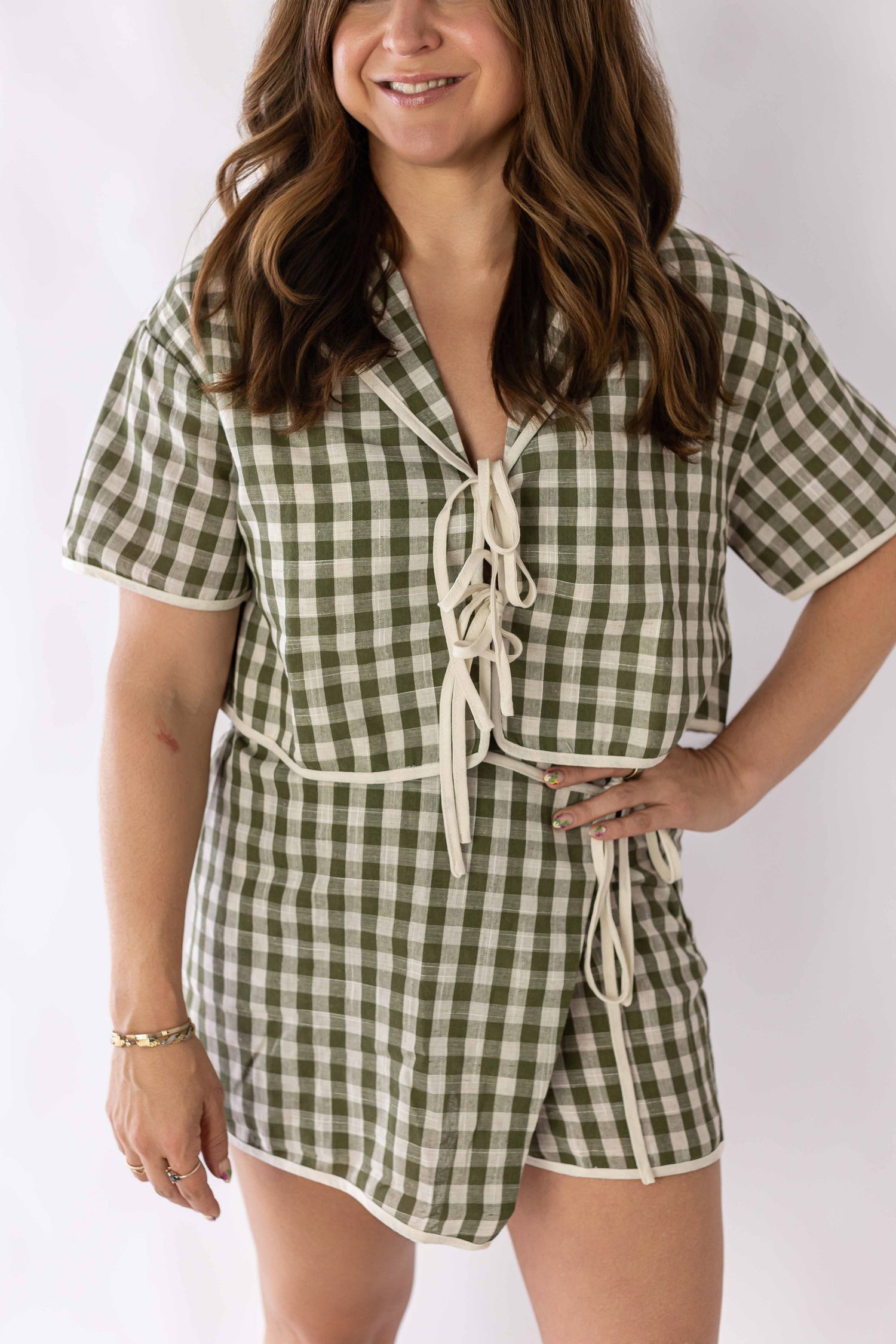 Weaving Color gingham skort set in green and white check with short sleeves and tie front detail