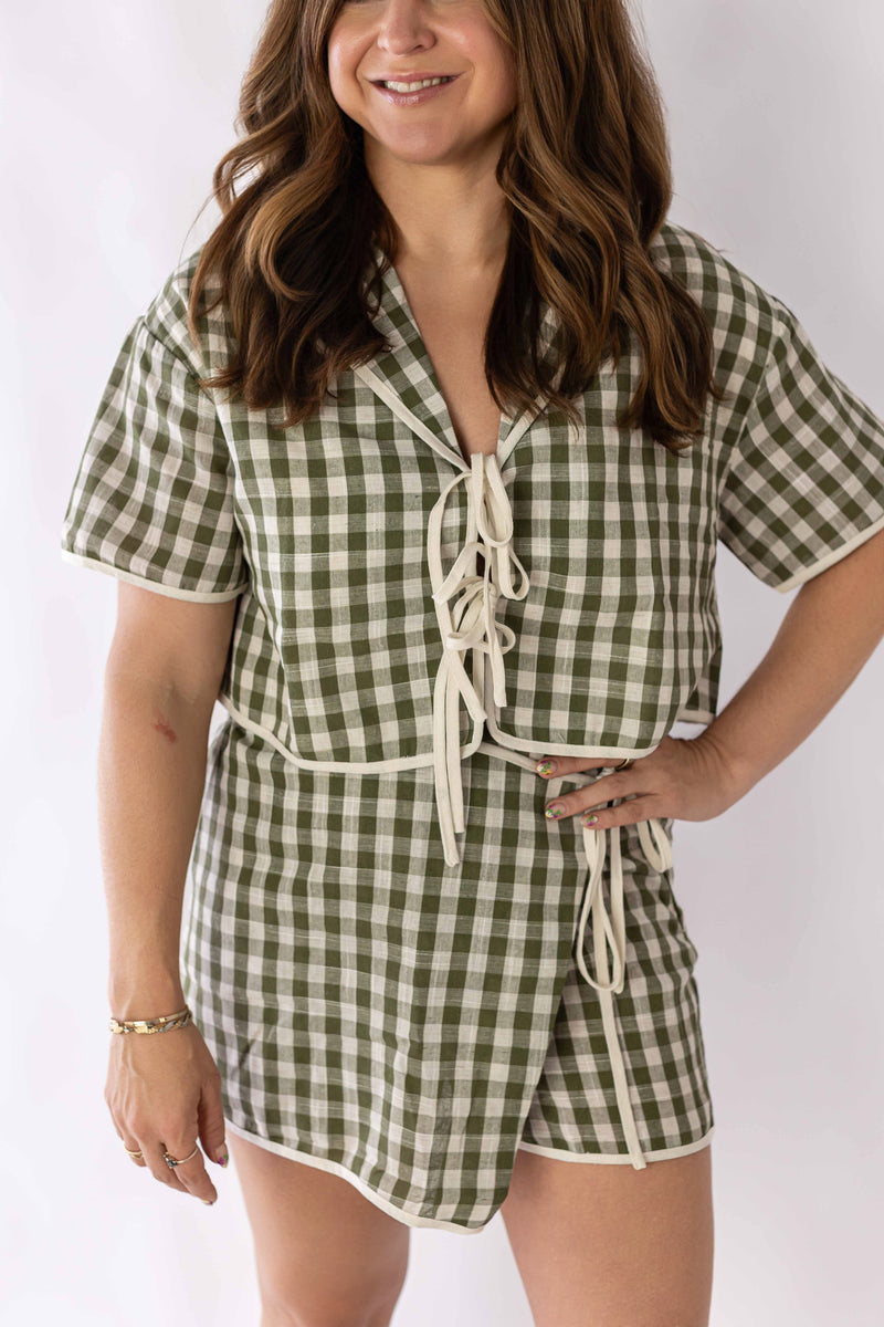 Weaving Color gingham skort set in green and white check with short sleeves and tie front detail