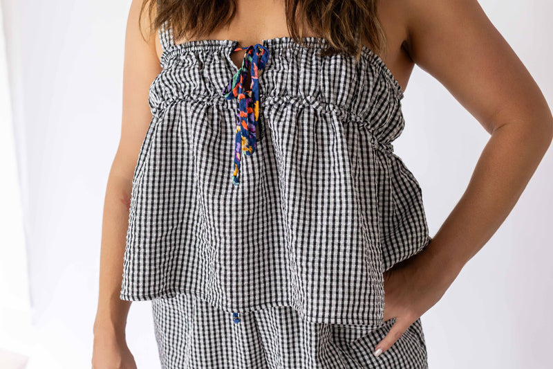 Weaving Color black and white gingham tie front top with colorful tie detail on a female model