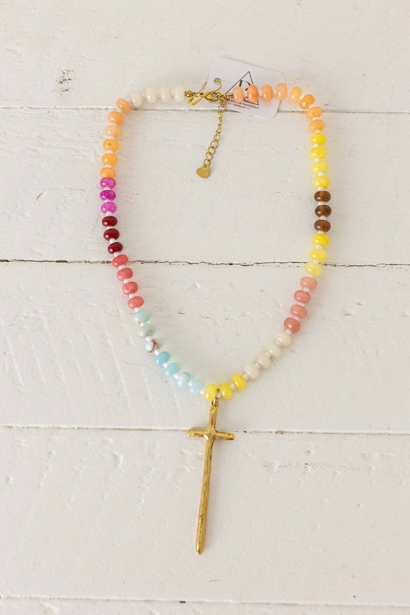 Weaving Color grace necklace with multicolor beads and gold cross pendant on white background