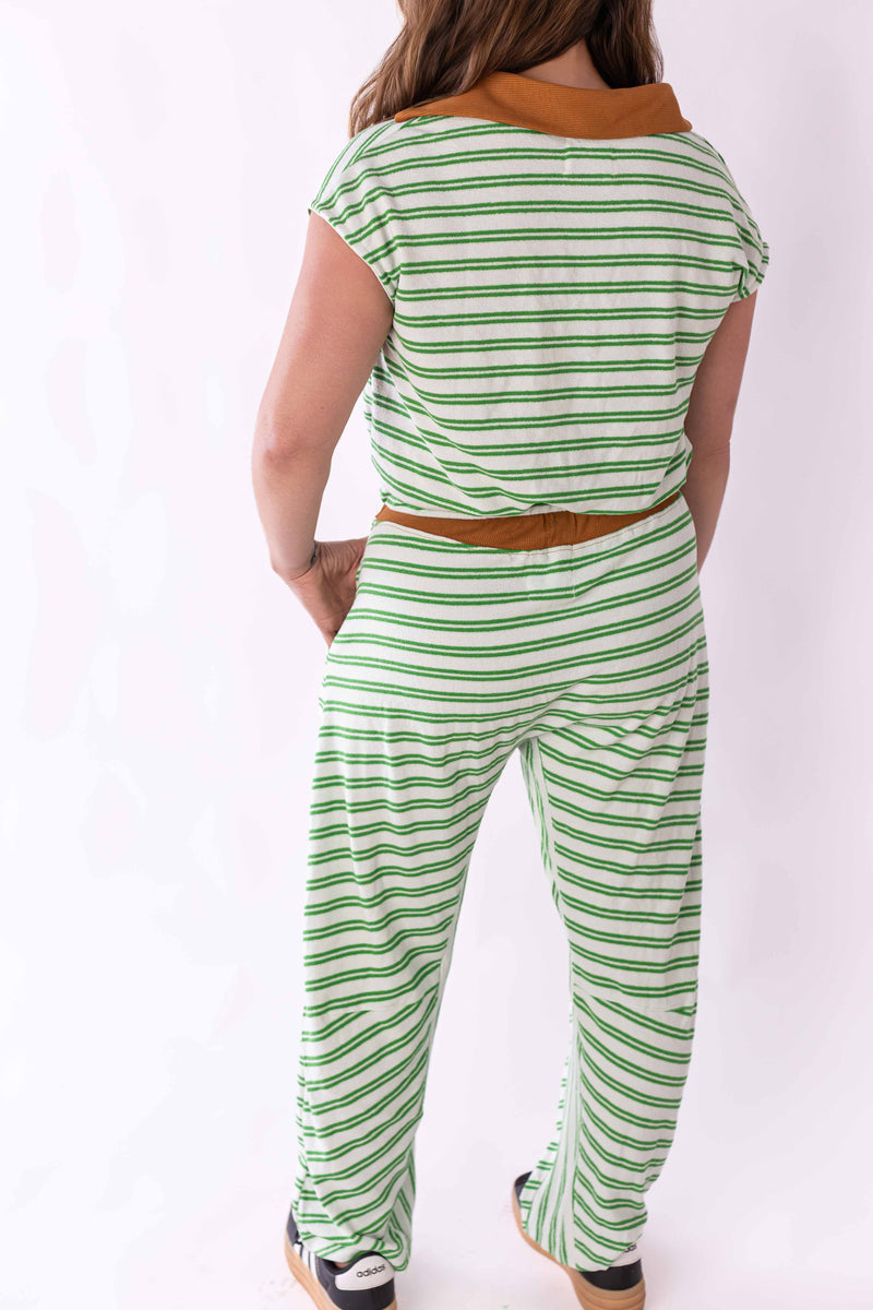 Back view of woman wearing Weaving Color green stripe lounge set with brown collar and waistband