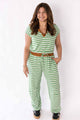 Woman wearing Weaving Color green stripe lounge set with short sleeves and a drawstring waist