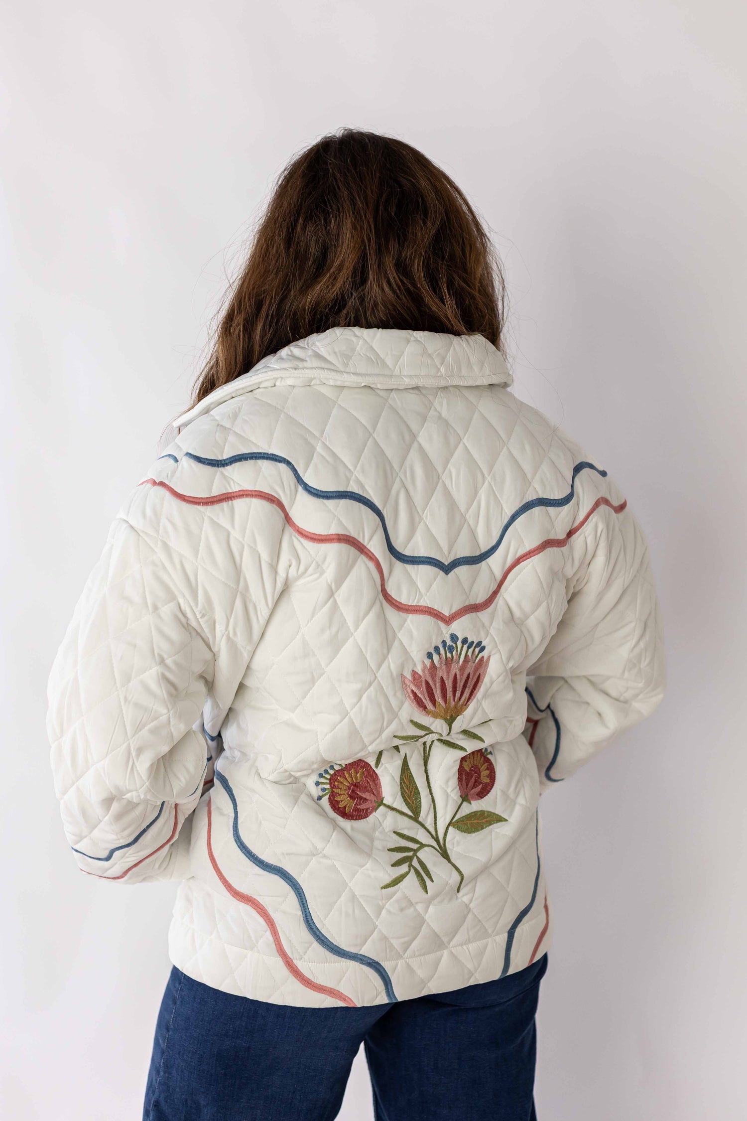 Weaving Color meadow bloom quilted jacket in white with floral embroidery and wavy blue and pink lines