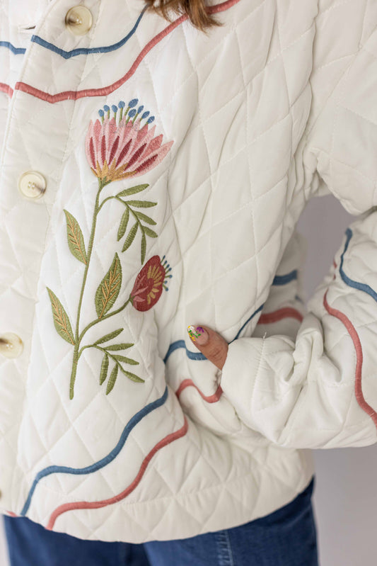 Weaving Color meadow bloom quilted jacket in white with floral embroidery and wavy colored trim