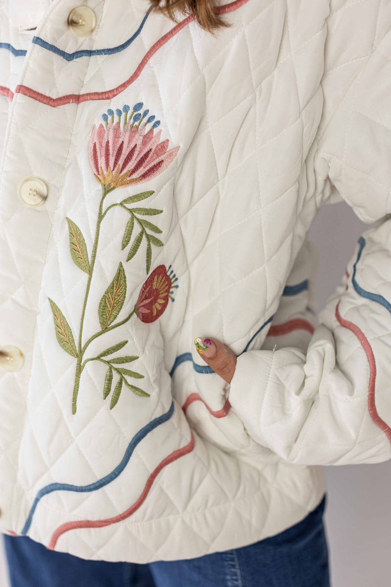 Weaving Color meadow bloom quilted jacket in white with floral embroidery and wavy colored trim