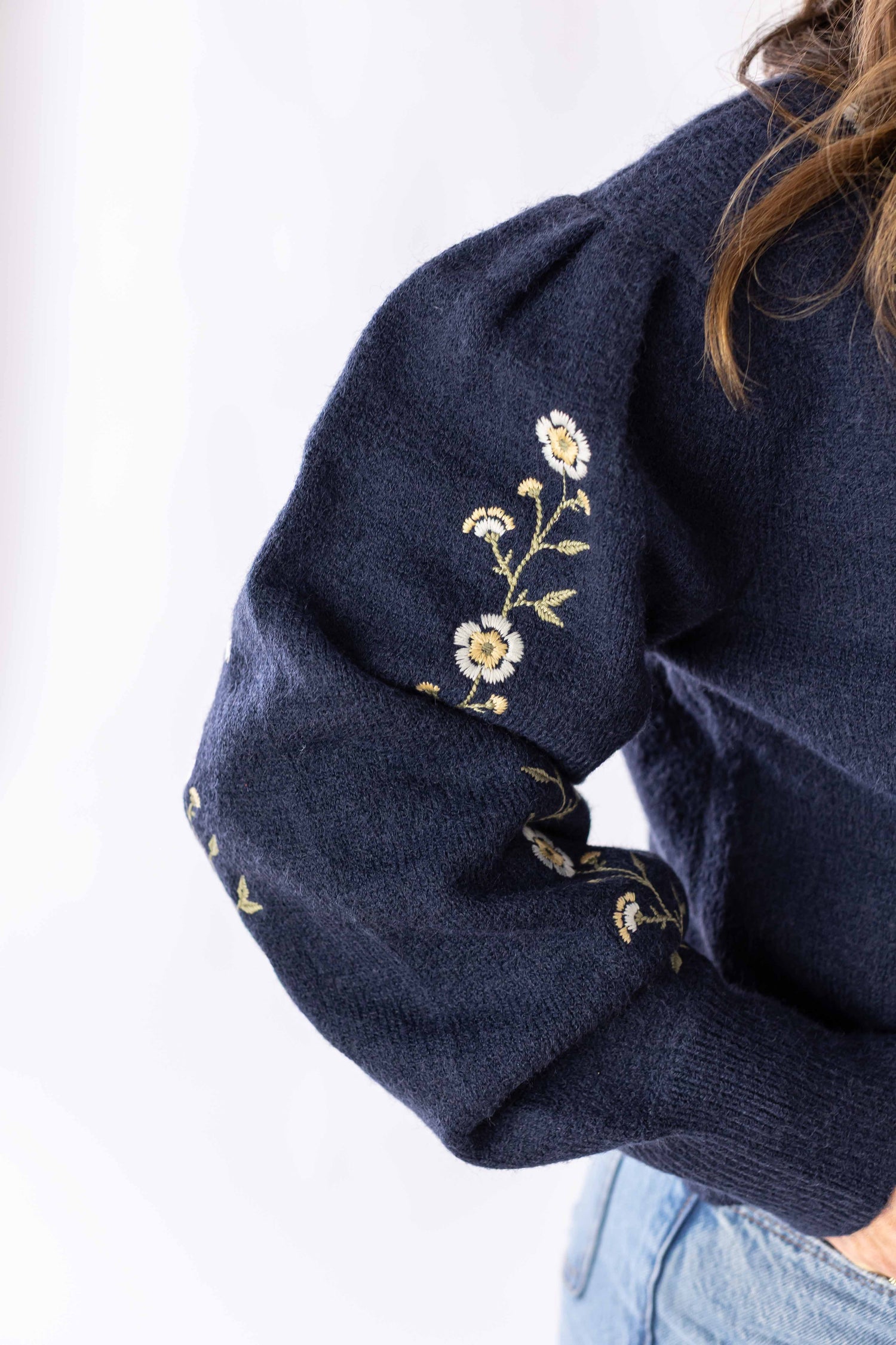 Weaving Color navy blue daisy chain sweater sleeve with delicate floral embroidery detail