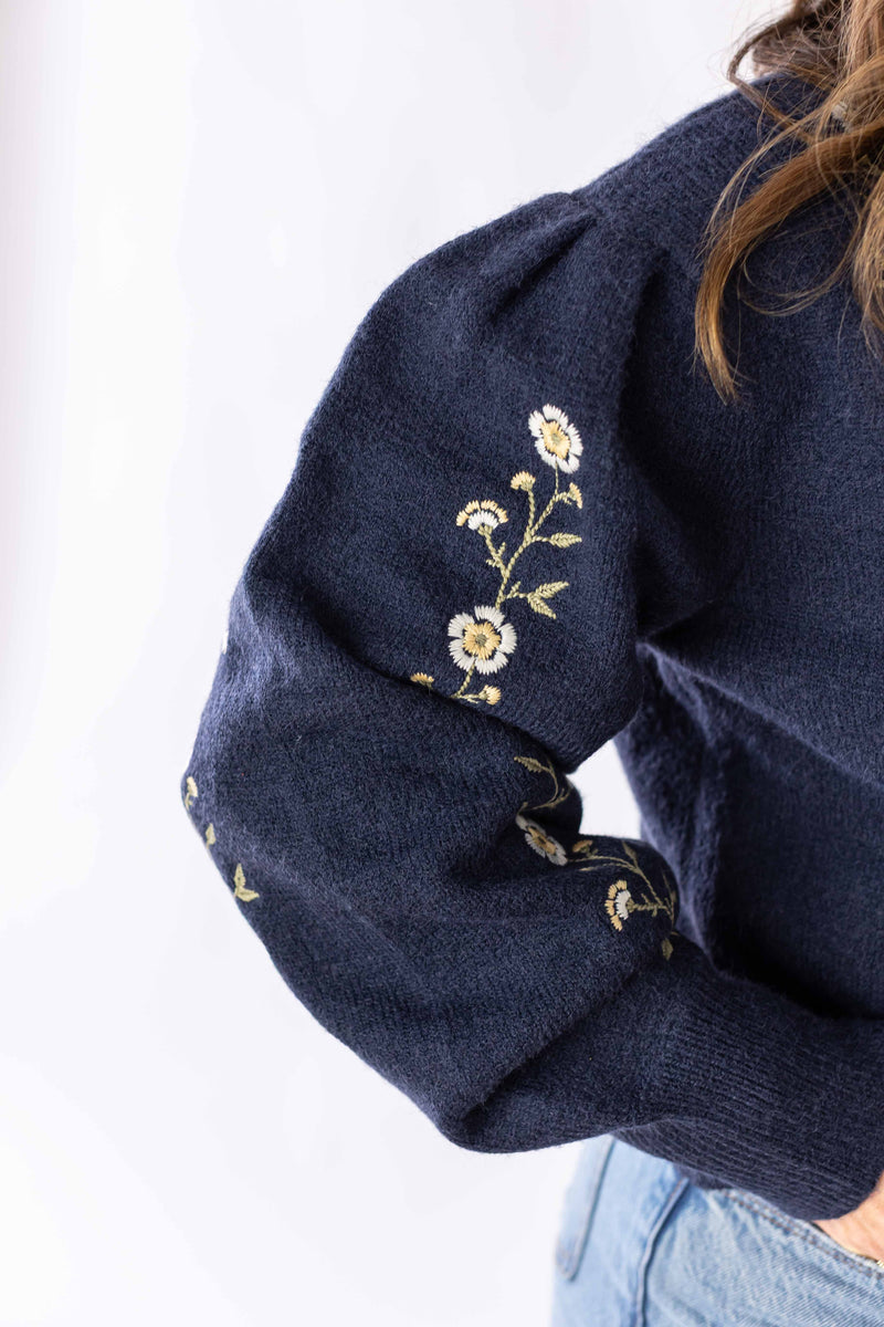 Weaving Color navy blue daisy chain sweater sleeve with delicate floral embroidery detail