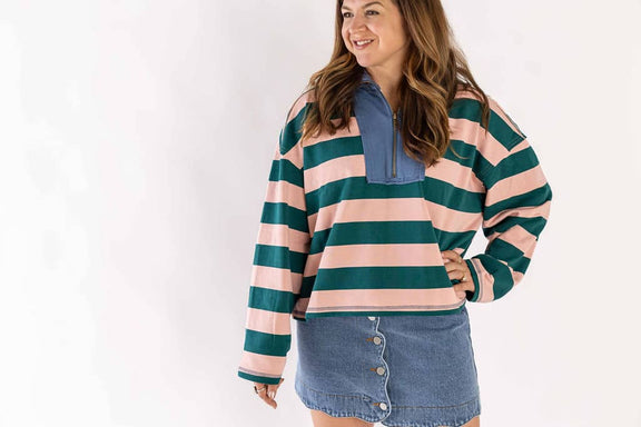 Weaving Color striped quarter zip top with green and pink stripes worn with a buttoned denim skirt