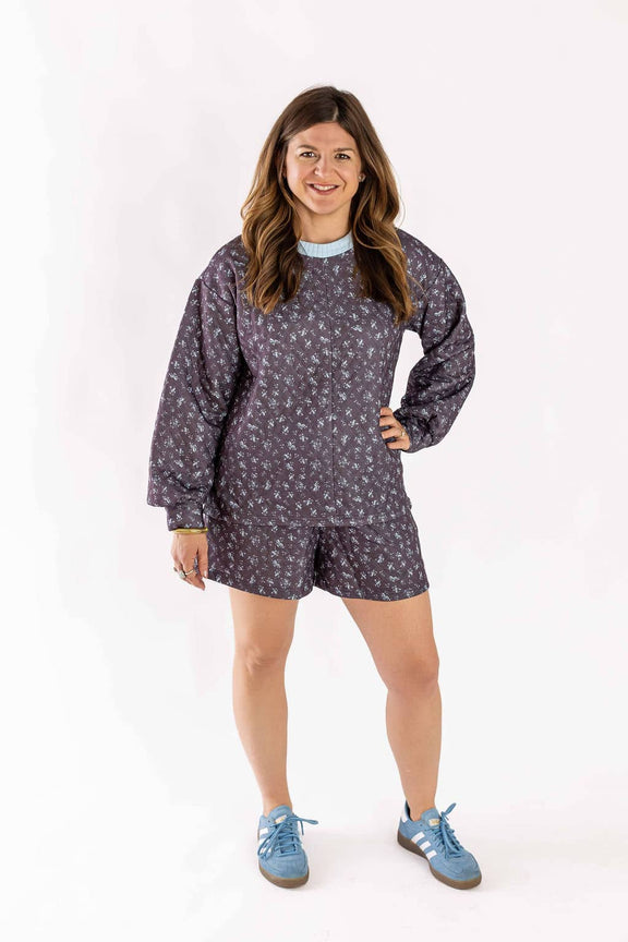 Woman wearing Weaving Color quilted set with long-sleeve top and shorts in a floral pattern