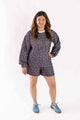 Woman wearing Weaving Color quilted set with long-sleeve top and shorts in a floral pattern