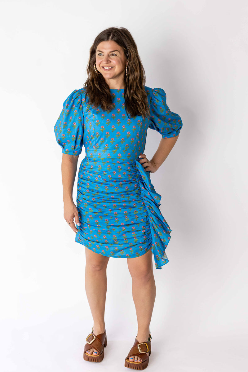 Weaving Color ruched puff sleeve mini dress in bright blue with orange floral pattern and side ruffle detail