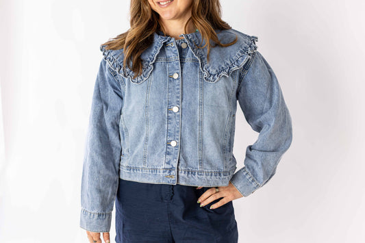 Weaving Color ruffle collar denim jacket in light blue worn by woman with long sleeves and button front