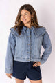 Weaving Color ruffle collar denim jacket in light blue worn by woman with dark shorts