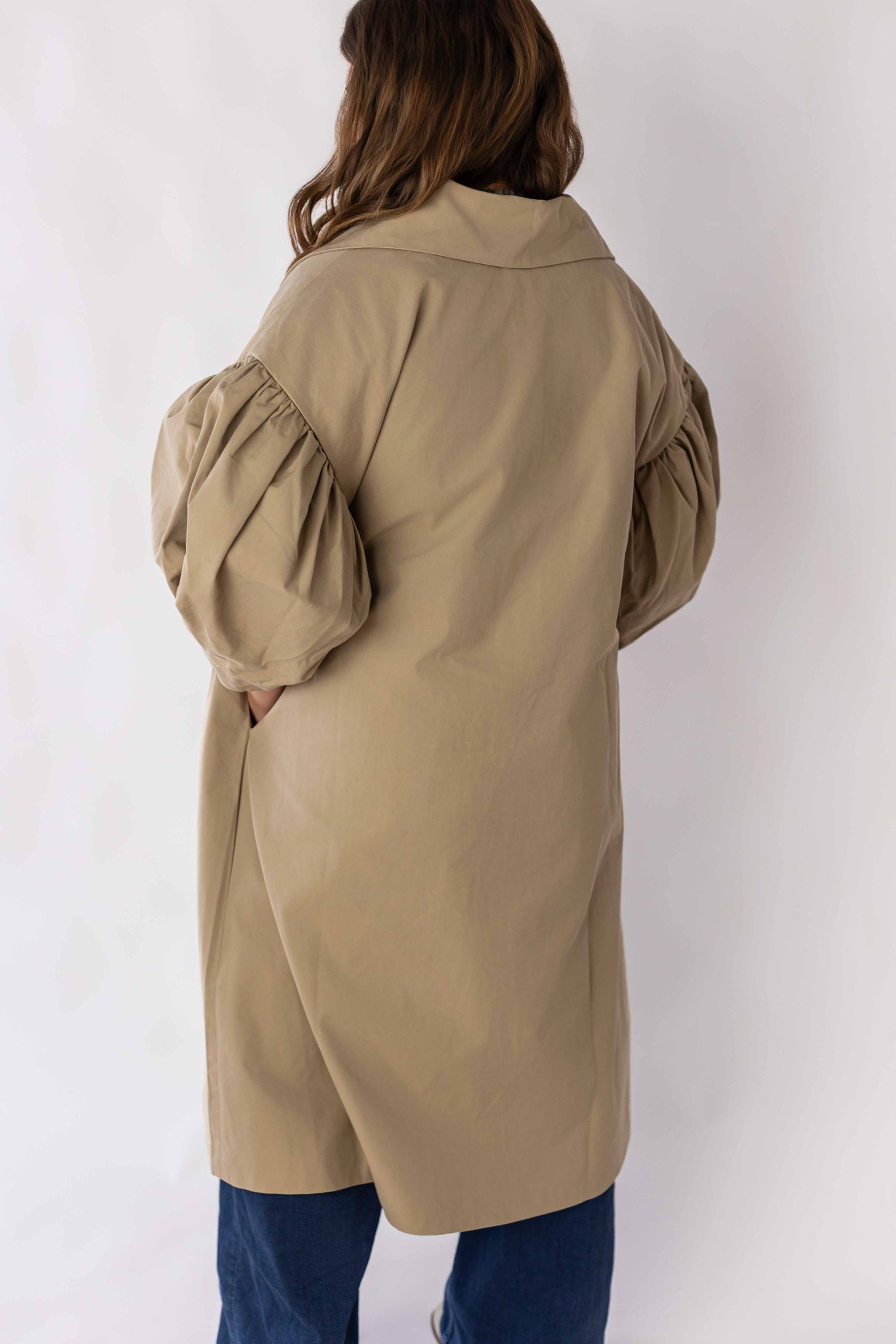 Back view of scallop edge puff sleeve trench coat by Weaving Color in beige color