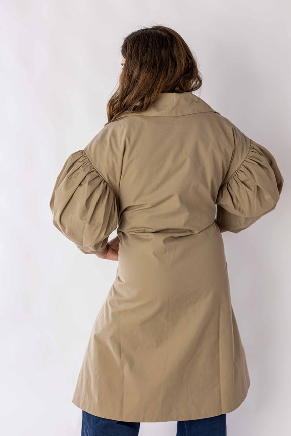 Back view of scallop edge puff sleeve trench coat by Weaving Color in beige with voluminous puff sleeves