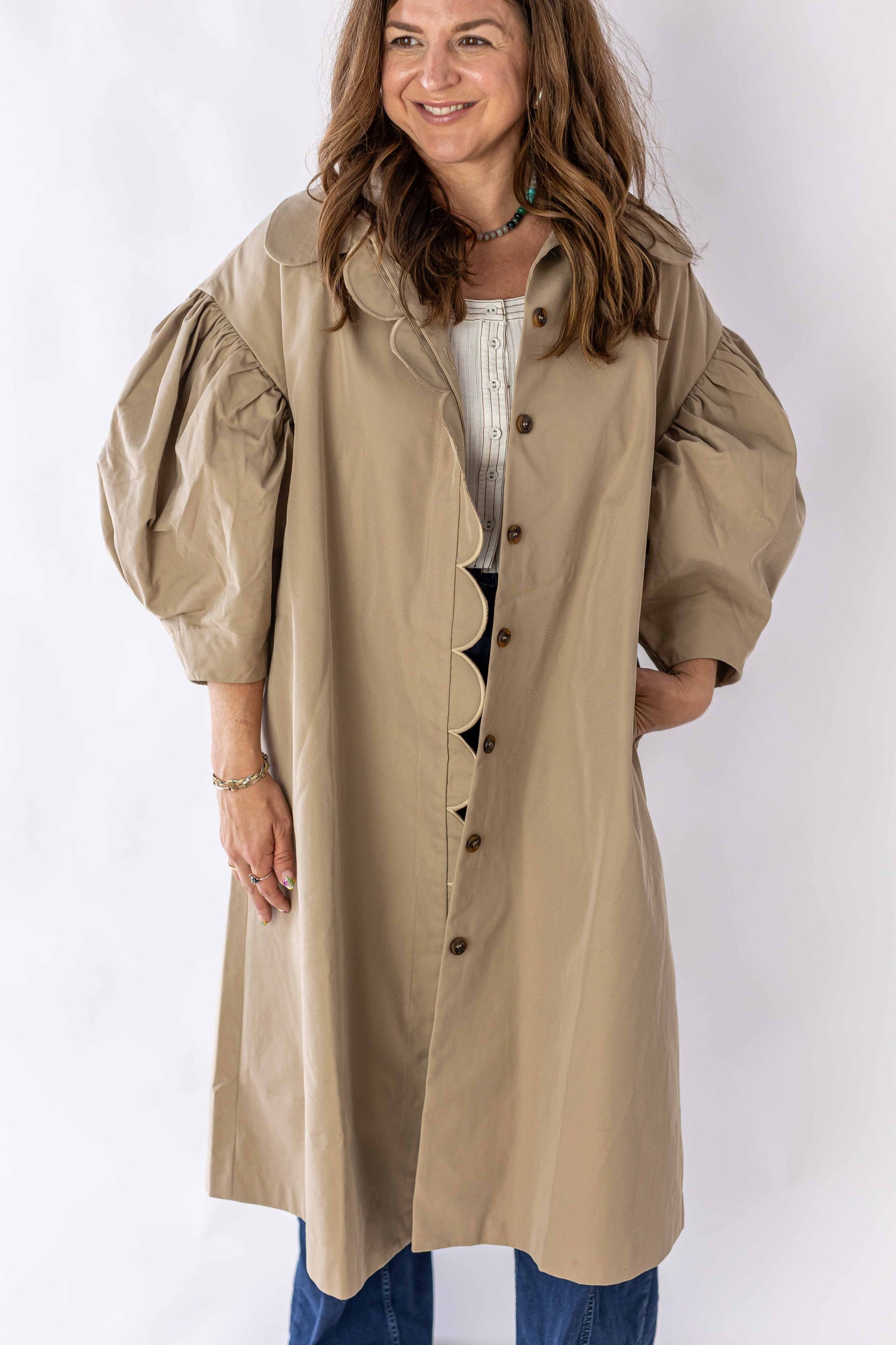 Weaving Color scallop edge puff sleeve trench coat in beige with button front and voluminous sleeves