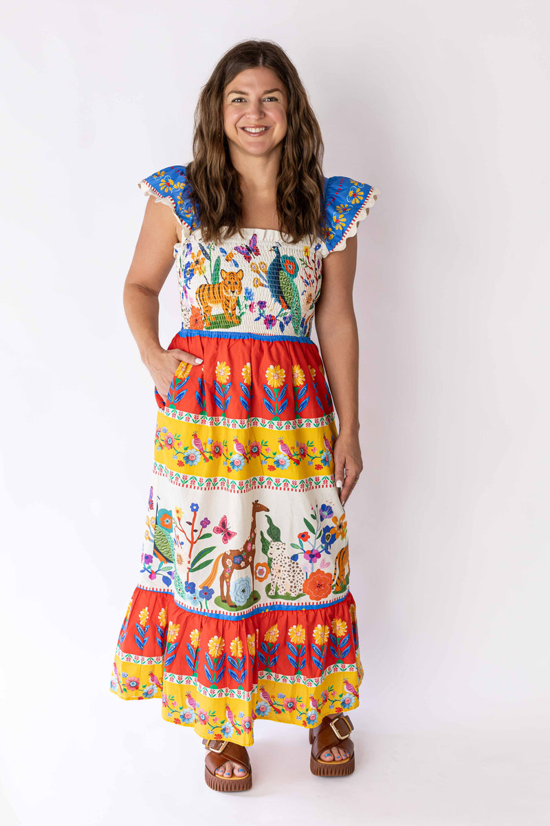 Weaving Color wild garden maxi dress with colorful animal and floral embroidery worn by smiling woman